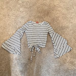 White and black striped flared long sleeve shirt, with bow.